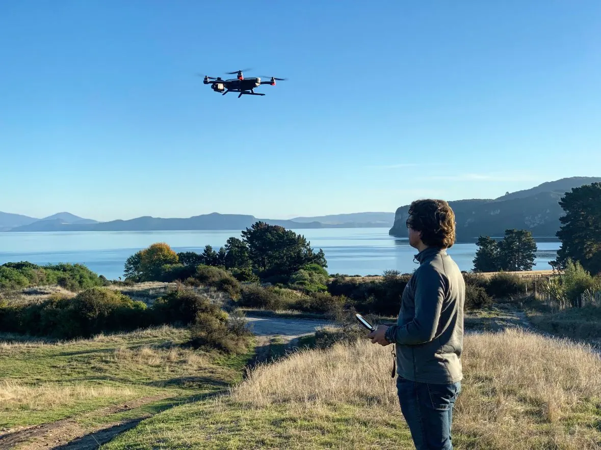 Dan flying a drone above a Northland harbour